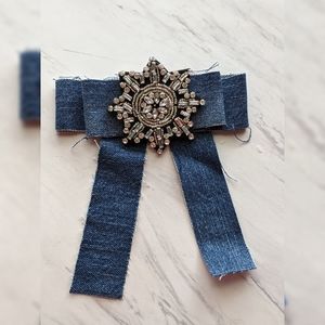 Distressed denim bowtie brooch